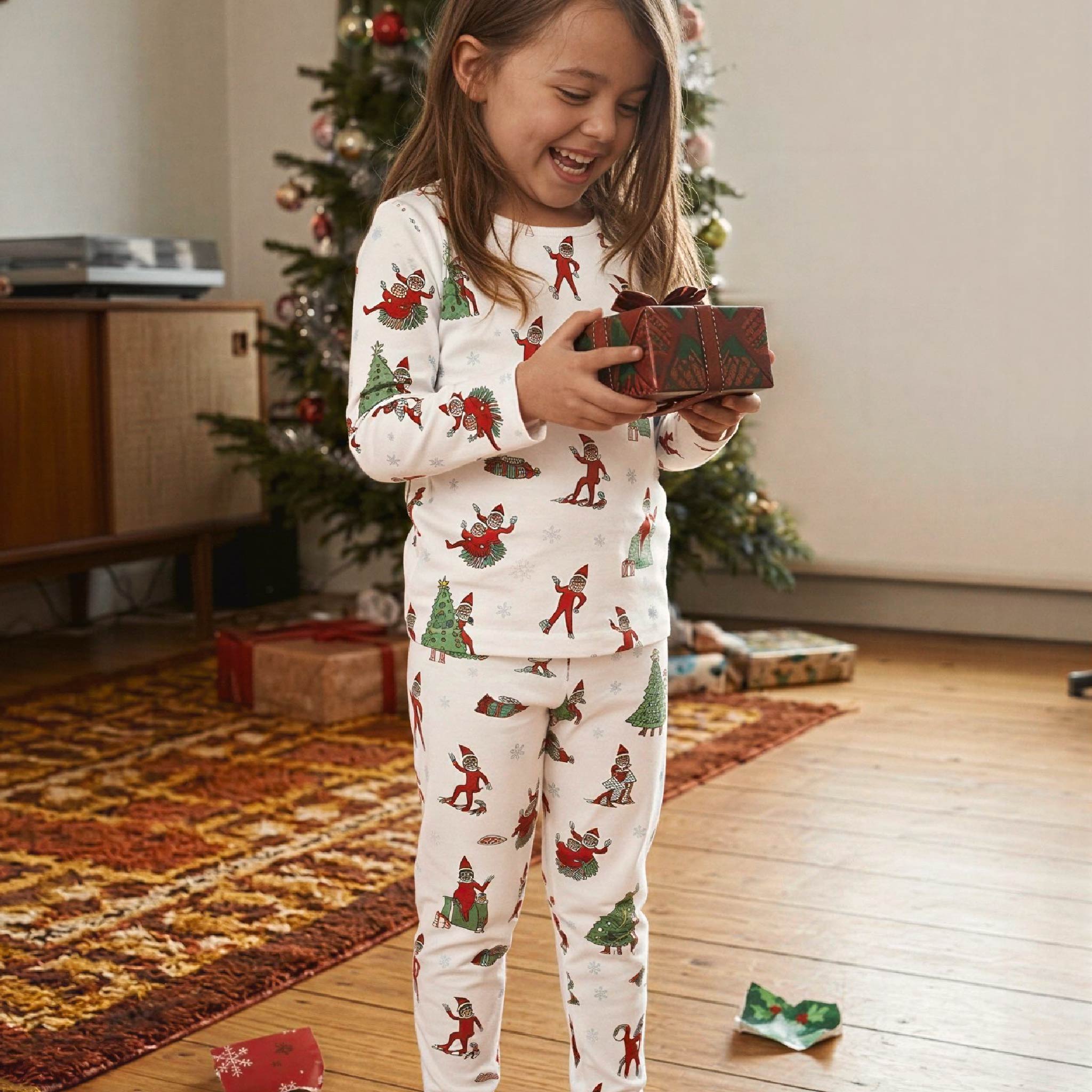 Child wearing Bellabu Bear bamboo kids pyjamas in The Elf on the Shelf print, second view