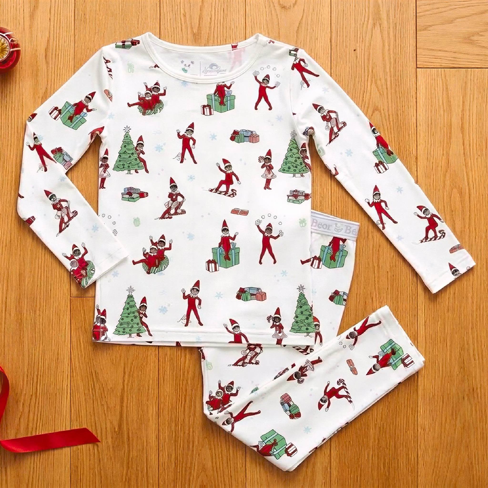 Flat lay of the Bellabu Bear bamboo kids pyjama set in The Elf on the Shelf print, long-sleeve top and full-length bottoms
