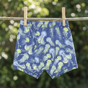 Boy wearing Sweet Bamboo Glow Zone bamboo trunks from the boys 3-pack, sizes 7Y and 8Y